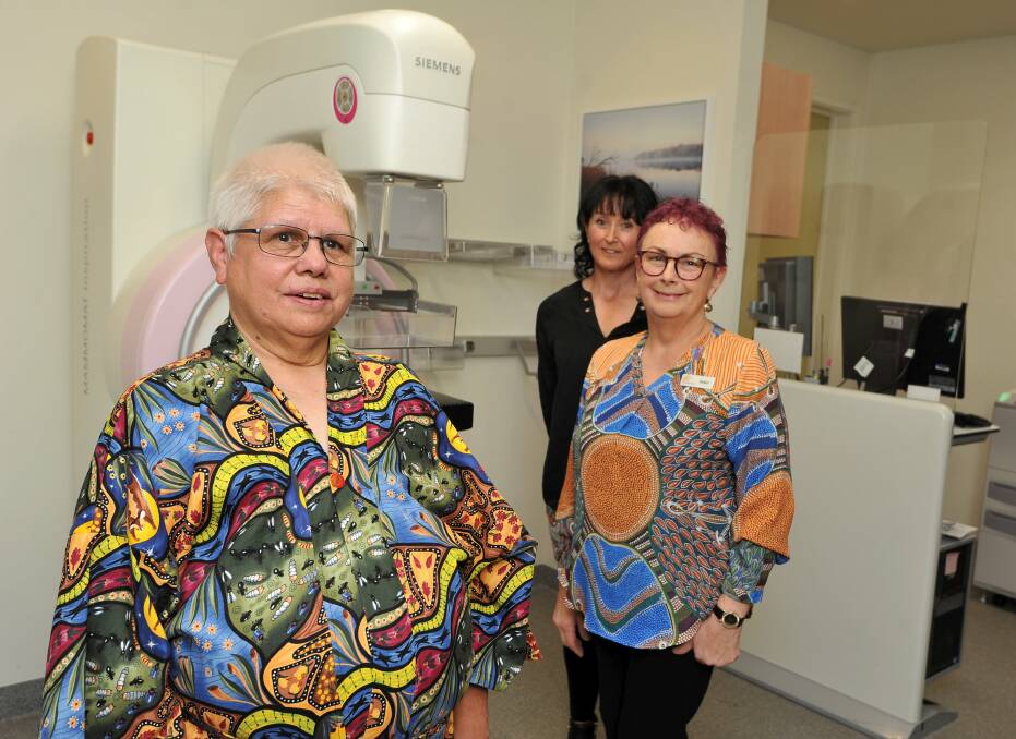 SUPPORT: Breast cancer survivor Kym Krasa, wearing a new indigenous gown checks in with BADAC medical clinic women's health nurse Sandy Anderson and Grampians Breast Screen program manager Kim Kyatt. Picture: Lachlan Bence