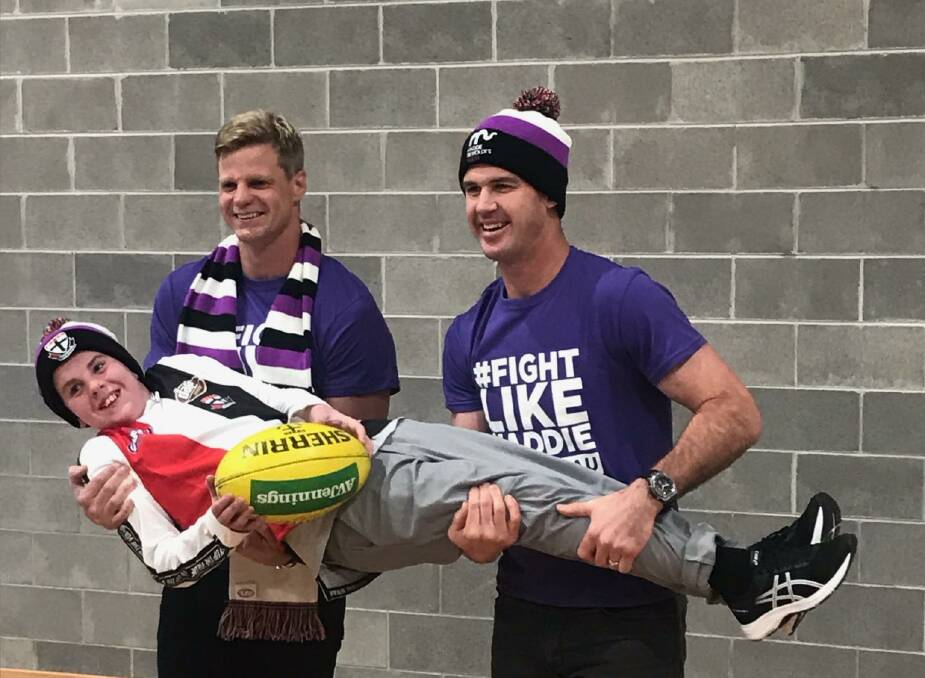 SUPPORT: AFL heroes Nick Riewoldt and Jonathan Brown carry Ballarat's Blake Dridan. Picture: courtesy of the Dridan family