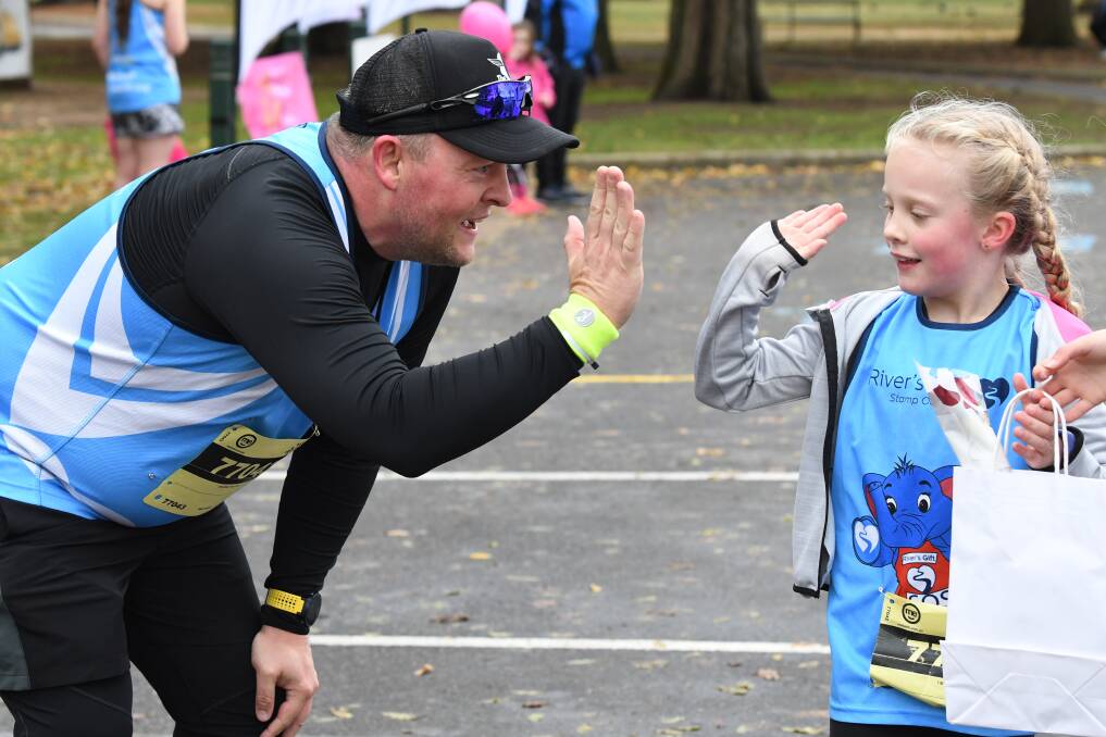TEAM SUPPORT: Winter Valley's Mick Wallbank and Niamh celebrate their efforts in the annual Mothers' Day Classic fun run in May at Lake Wendouree. Picture: Kate Healy