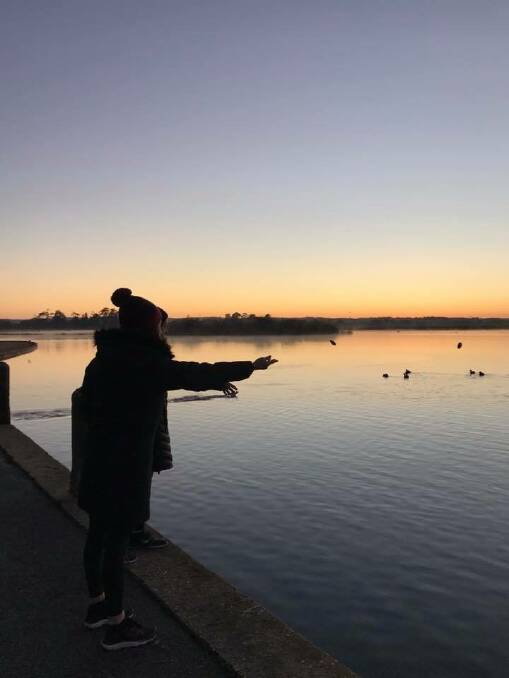 A young person casts a stone in Lake Wendouree in memory of a loved one, lost to suicide, in last year's Out of the Shadows walk. Picture: Ballarat and District Suicide Prevention Network