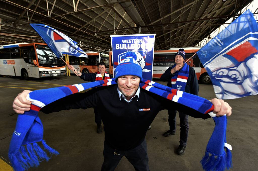 SNARLING: Ballarat Western Bulldogs Supporters Group president Ray Neville, flanked by colleagues Caroline Jones and Las Papp, calls on the city for support this AFL Grand Final day. Picture: Jeremy Bannister