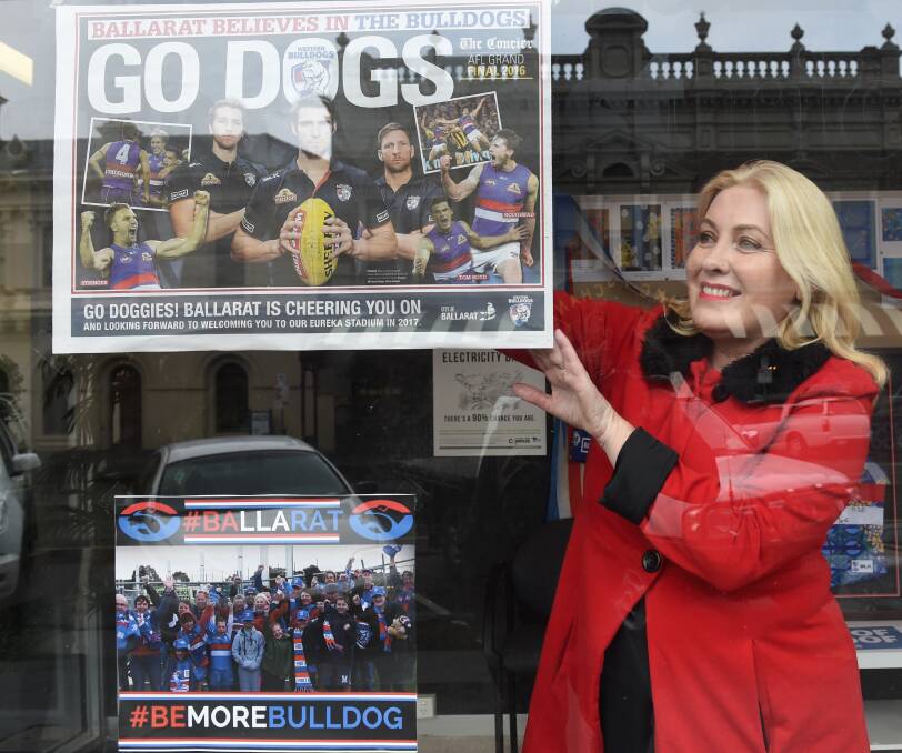 PROUD: Wendouree MP Sharon Knight gets in the Bulldogs spirit of painting the town red, white and blue. Inside, her office is filled with streamers. Picture: Lachlan Bence