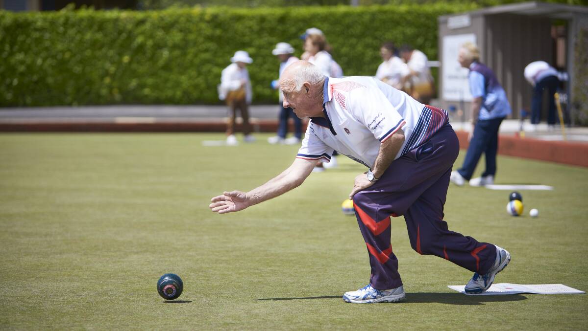 FOCUS: Central Wendouree's Rob Watson puts down a bowl under pressure in Ballarat District Bowls Division midweek pennant division one action on his home greens on Monday. Picture: Luka Kauzlaric