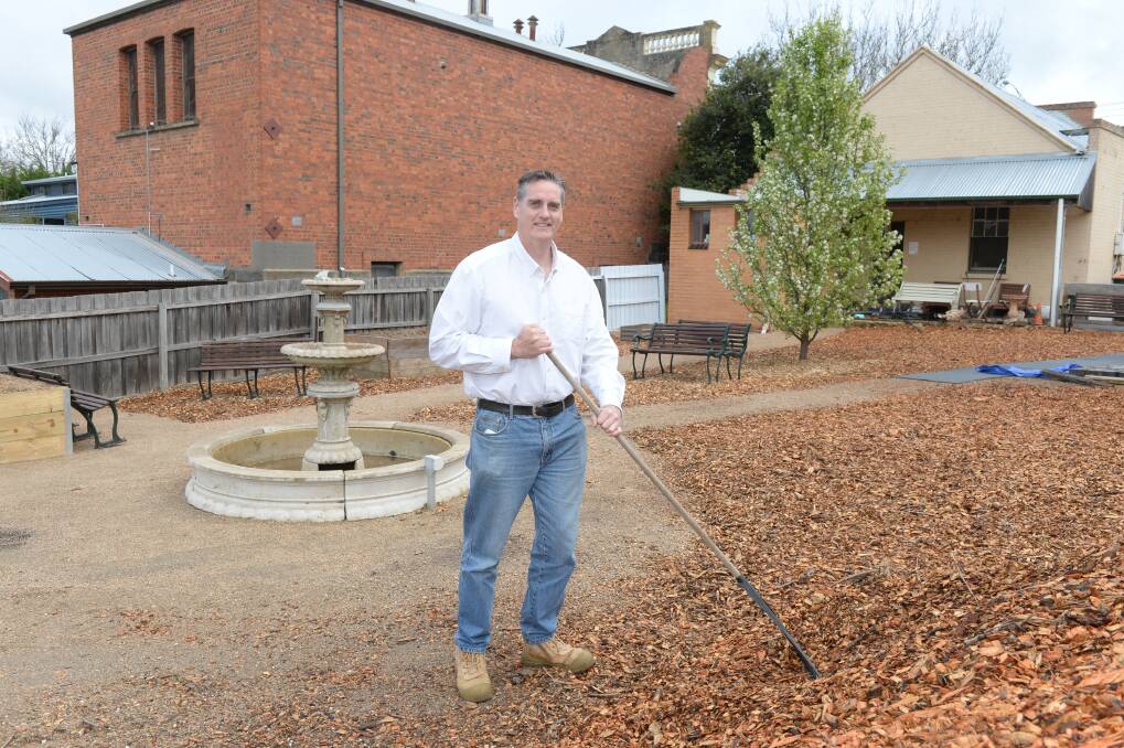 SHAPING UP: Shannon's Bridge co-founder Jeremy McKnight tends the sensory garden last week. Picture: Kate Healy