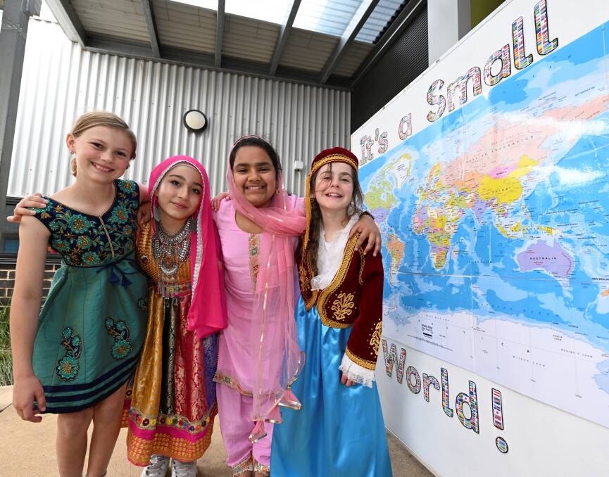 Alfredton primary's Audrey (Ireland), Leena (Afghanistan), Jaskirat (India) and Aylee (Greece) say it has been fun learning more about their own heritage and sharing with classmates. Picture by Lachlan Bence