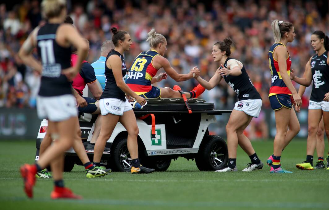 Adelaide's Erin Phillips after injuring her knee during the AFLW grand final match against Carlton at Adelaide Oval. Picture: AAP