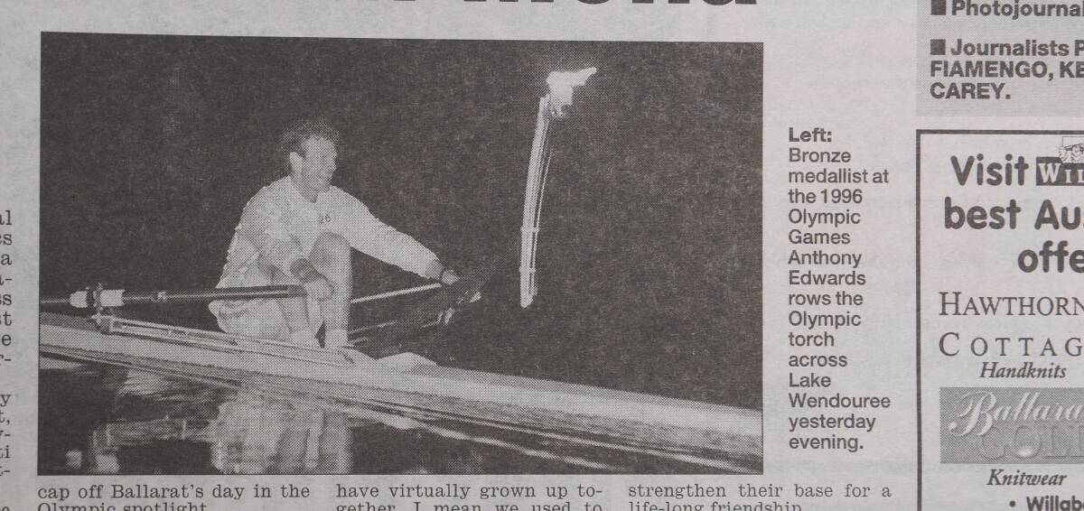 A clipping from The Courier show "bronze medallist from the 1996 Olympic Games Anthony Edwards rows the Olympic torch across Lake Wendouree". 