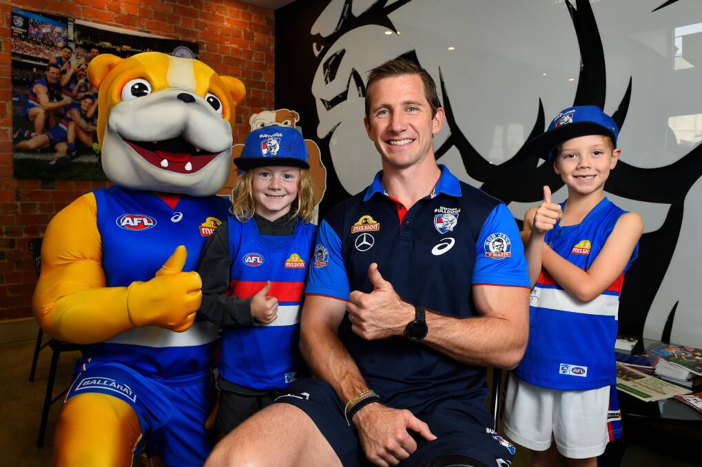 STAR POWER: Dale Morris meets young Western Bulldogs fans in Ballarat in 2019. He has since grappled with 'life after football' but says early lessons set him in good stead.