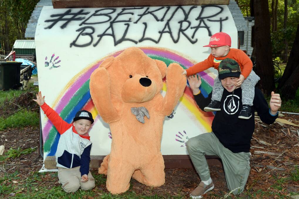 BRIGHT NOTE: Enfield's Mason, Cooper, Harvey and Tristan Hodgkoss get into the rainbow and teddy bear trail spirit in early lockdowns. Picture: Kate Healy