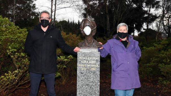READY: City of Ballarat mayor Ben Taylor and chief executive officer Janet Dore don masks with Prime Minister Julia Gillard's bust in Ballarat Botanical Gardens last month. Picture: Kate Healy