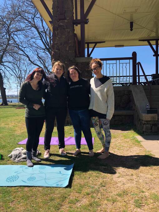 Post-workout after Michelle Bowler's free yoga class by the lake to celebrate Mental Health Month.