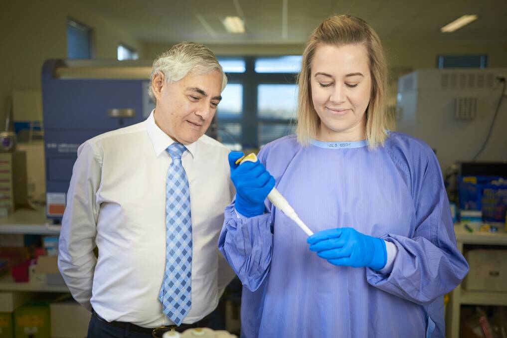 BREAKTHROUGH: Professor George Kannourakis with post-doctoral research fellow Jenee Mitchell, whose work on a rare cancer has the potential to change treatment for inflammatory conditions. Picture: Luka Kauzlaric