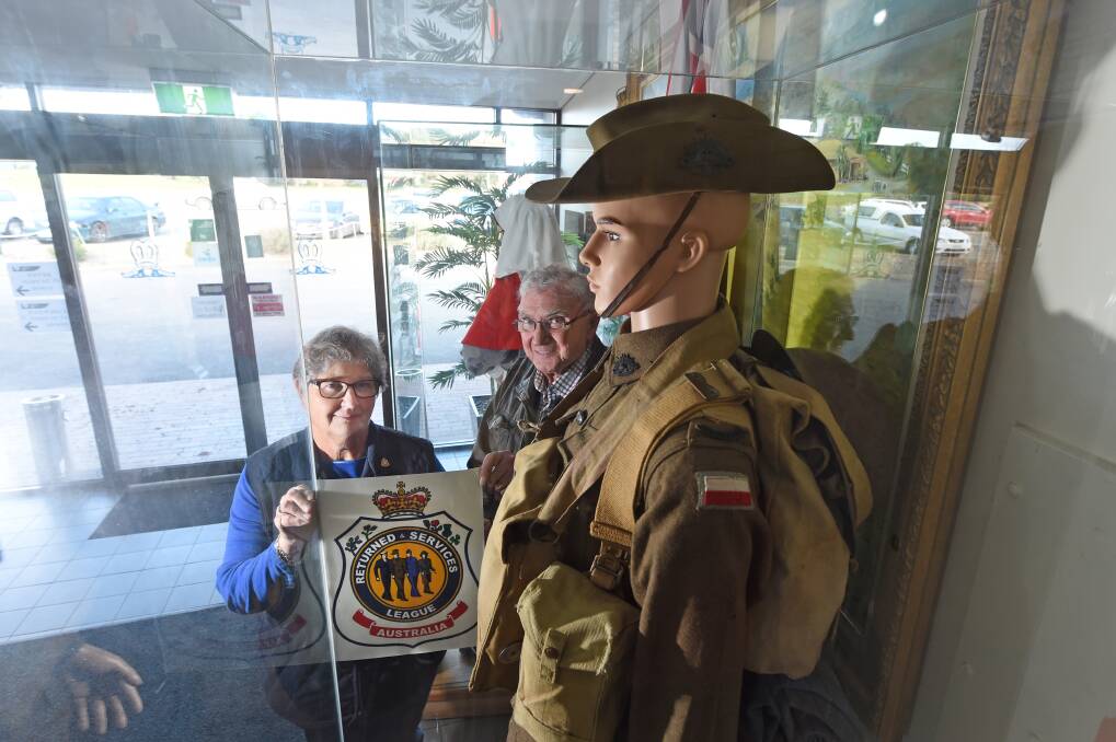 SETTLING IN: Ballarat RSL sub-branch president Alex Tascas and secretary Maurie Keating get decorated the club's new Midlands home. Picture:Jeremy Bannister