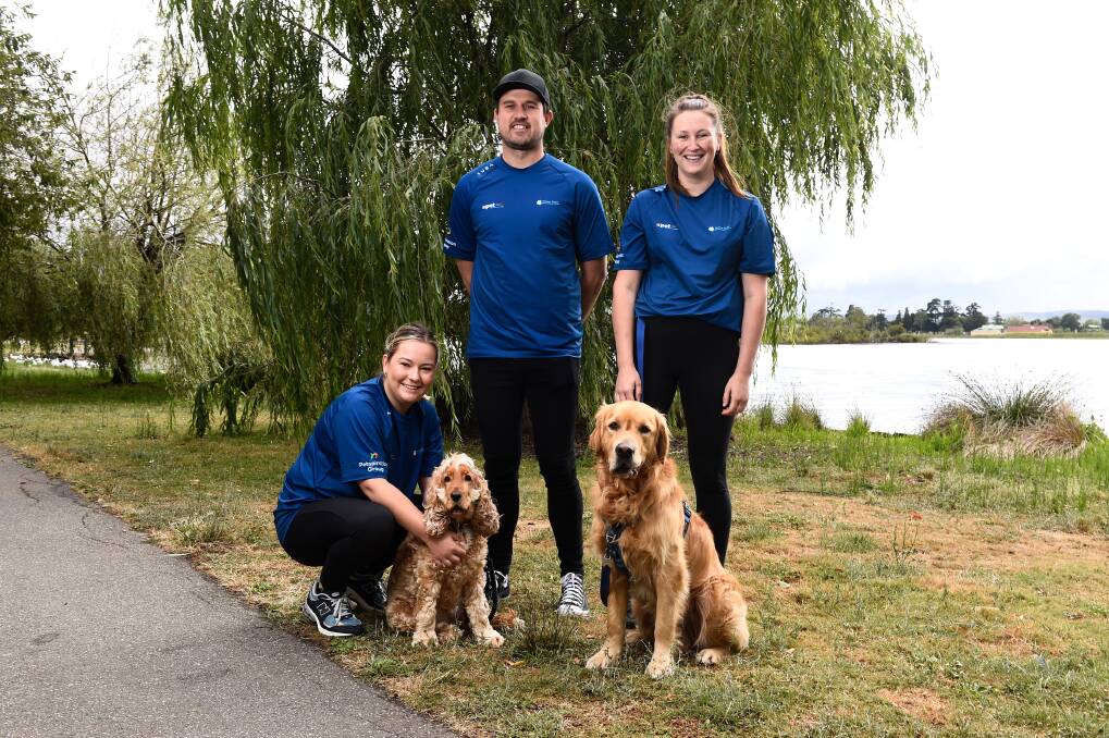 PETstock team members Tilly Coutts with dog Winnie, Jackson Merrett and Meg Hope with dog Loki are calling on Ballarat to join them in the annual pet-friendly walk for homegrown cancer research. Picture by Adam Trafford