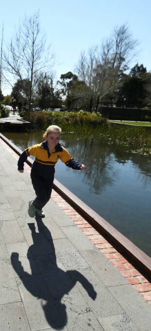 OFF AND RUNNING: Eight-year-old Tess Matthews starts training from the launch at Mercure Ballarat on Tuesday morning. Picture: Lachlan Bence