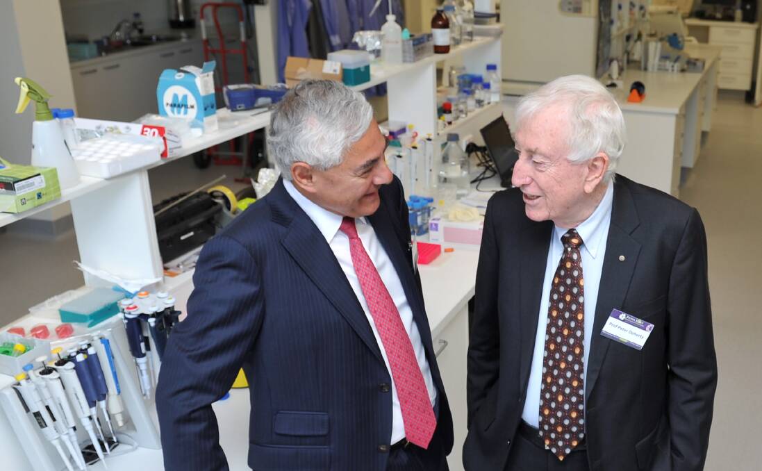 IMPRESSED: FECRI honorary director George Kannourakis shows Nobel laureate Peter Doherty about the institute's bright new laboratories before their official opening on Wednesday. Picture: Lachlan Bence