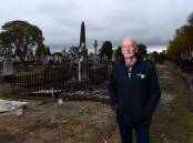 LEGACY: Ballarat war researcher Garry Snowden stands at the unmarked graves of brothers Kevin and William Coghlan, WWI soldiers, who rest in Ballarat Old Cemetery. Picture: Adam Trafford 