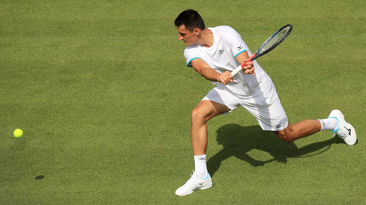 ACTION: Bernard Tomic in day two action at Wimbledon. Picture: AP