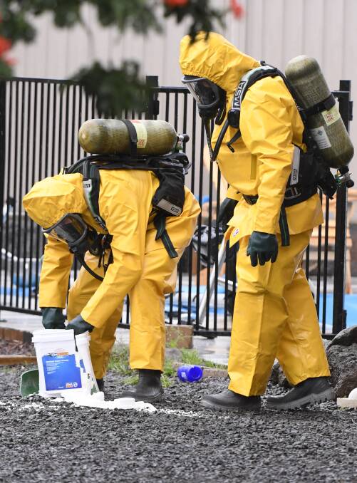 SCENE: Firefighters work to contain a chemical spill in Ballarat's north on Sunday afternoon. Picture: Lachlan Bence