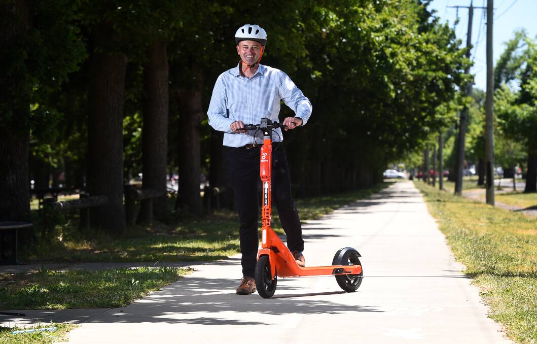 PRESENT: City of Ballarat mayor Daniel Moloney takes the new orange e-scooters for a ride this week. Picture: Adam Trafford