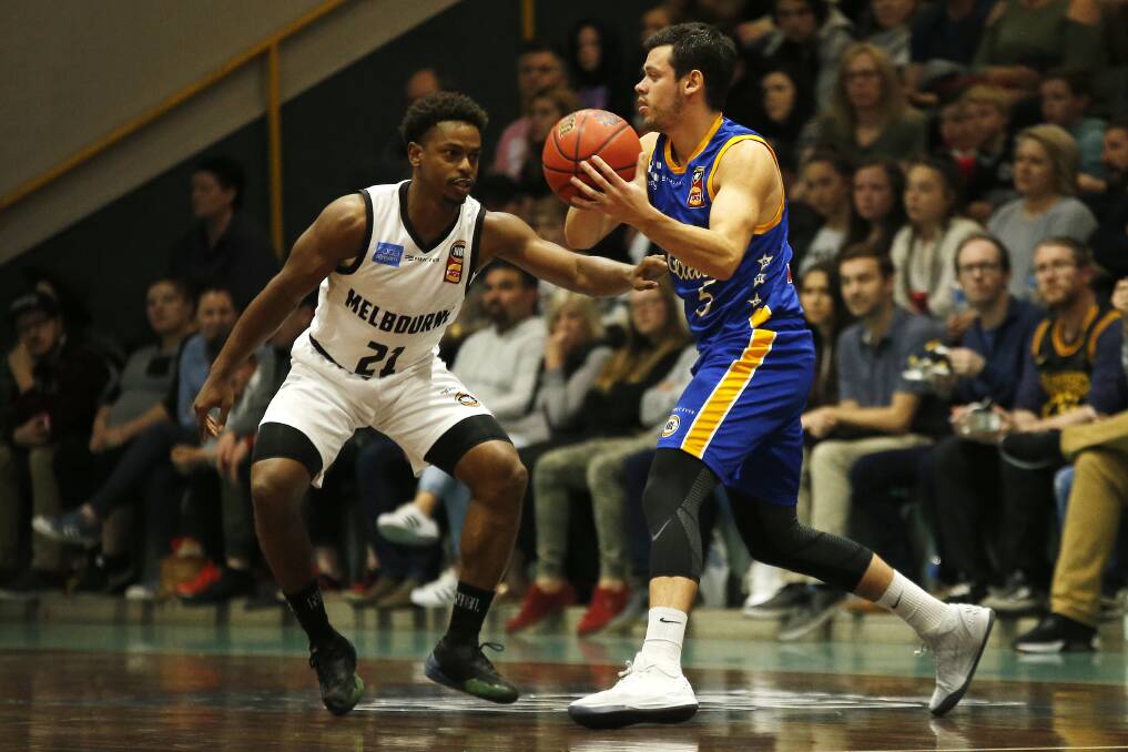 ACTION: Brisbane Bullet's Jason Cadee controls the ball ahead of Melbourne United's Casper Ware during the 2018 NBL Pre-Season Blitz match at the MARS Minerdome in Ballarat. Picture: Dylan Burns