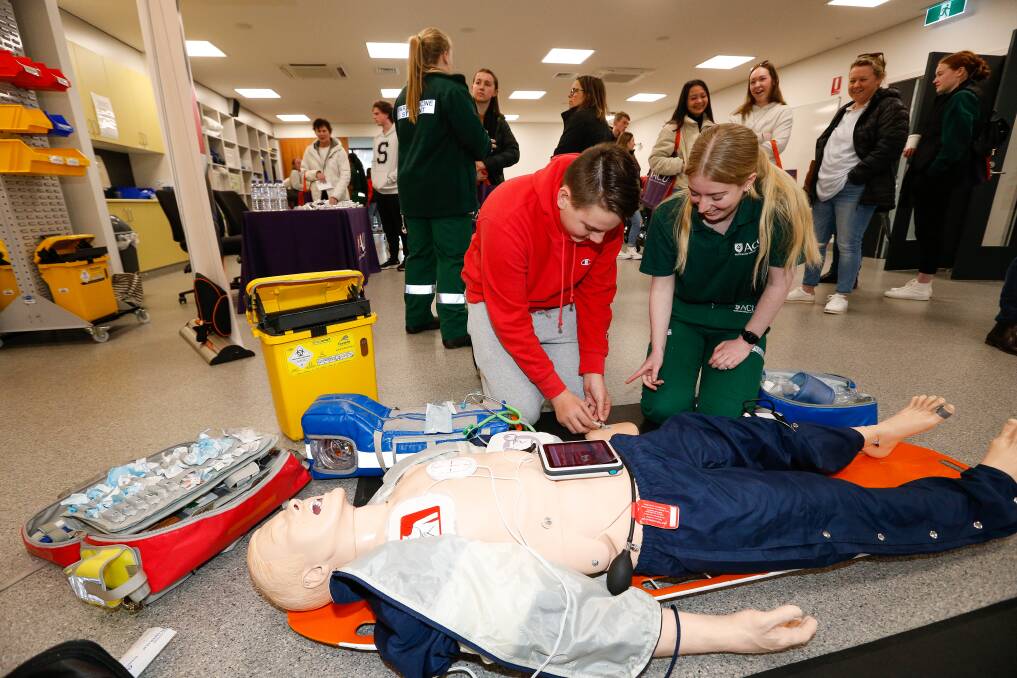 CRITICAL: Prospective student Emil Sprajc gets some hands on help from student Taylah Denouden at ACU Ballarat Open Day on Sunday. Picture: Luke Hemer