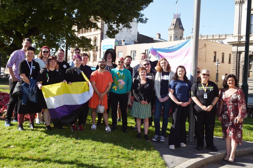VISIBLE: City of Ballarat mayor Daniel Moloney raises the transgender flag outside town hall with members of the trans community and allies. Picture: Kate Healy