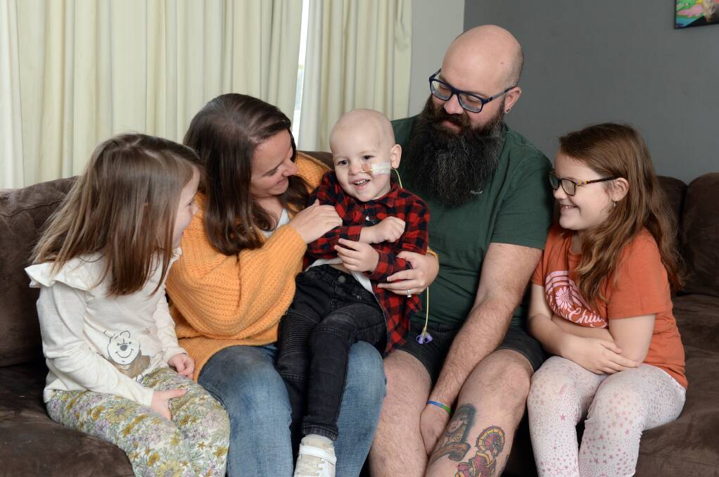 HOPE: Katie and George Davidson, with daughters Ava and Lily, say three-year-old George is an adventurous and fun-loving boy. The Davidsons hope to undertake life-saving treatment in the United States for him and are appealling for public help. Picture: Kate Healy