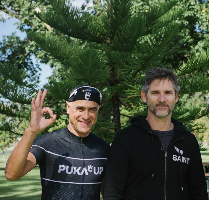 CHANGE-MAKERS: Hollywood star Eric Bana checks in with Wayne Schwass to add voice to the Puka Up ride on a Bendigo stop on Wednesday. Picture: Puka Up, Facebook
