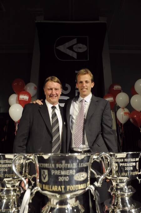 North Ballarat Roosters' triple premiership coach Gerard FitzGerald and captain Shaune Moloney with the three cups. Picture: Adam Trafford