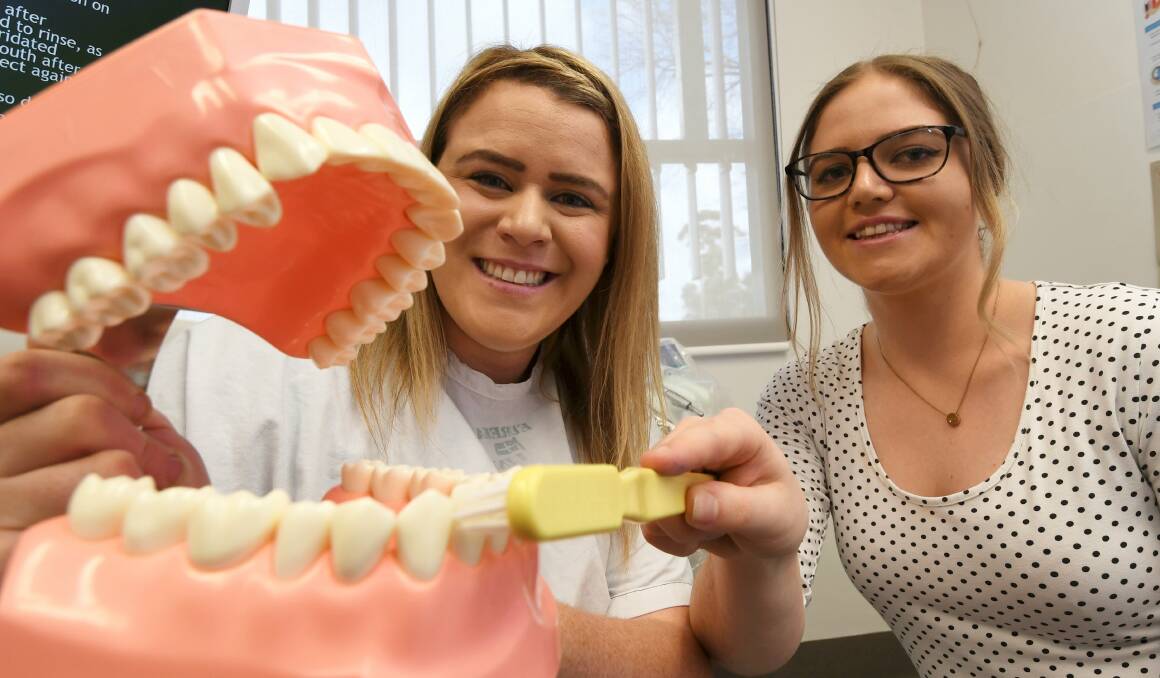 WATCH YOUR MOUTH: Ballarat oral health educators Jodie Morrison and Siobhan Shannon can help show how to brush for good overall health, well-being and a nice smile. Picture: Lachlan Bence