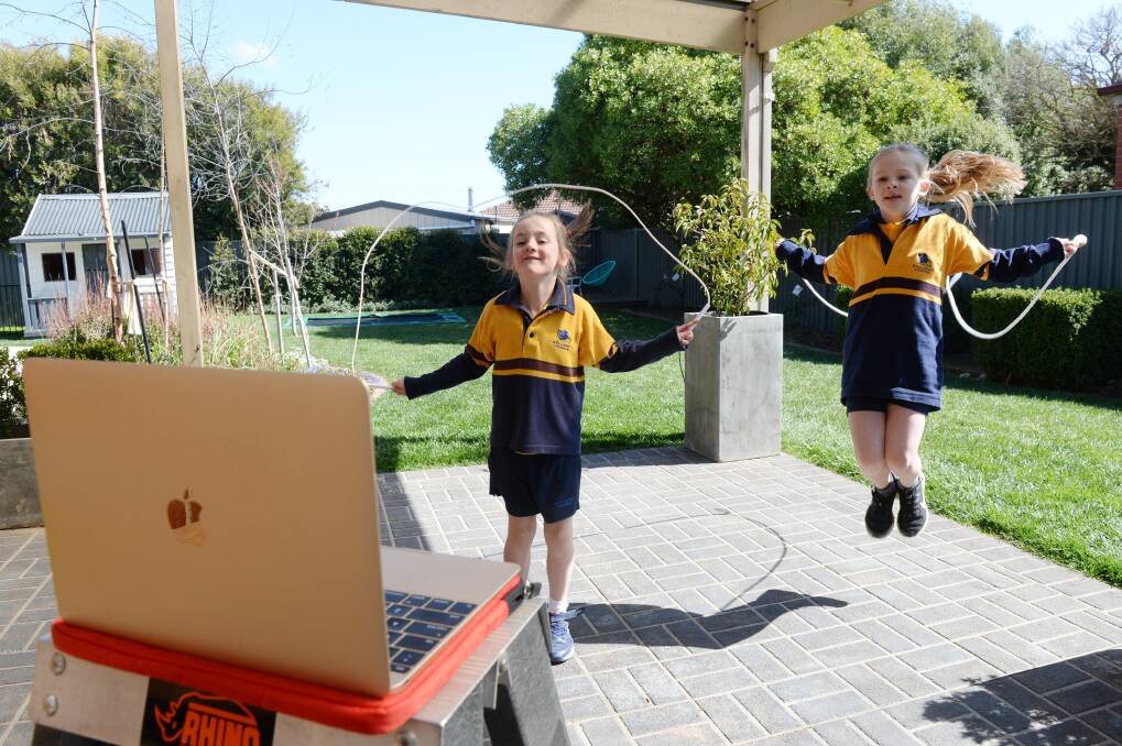 SKIPPING IN: Anna Merrifield, who had open-heart surgery as a baby, and sister Elena, who is almost eight, have been training hard to raise heart health awareness in a virtual skip-a-thon on Friday. Picture: Kate Healy