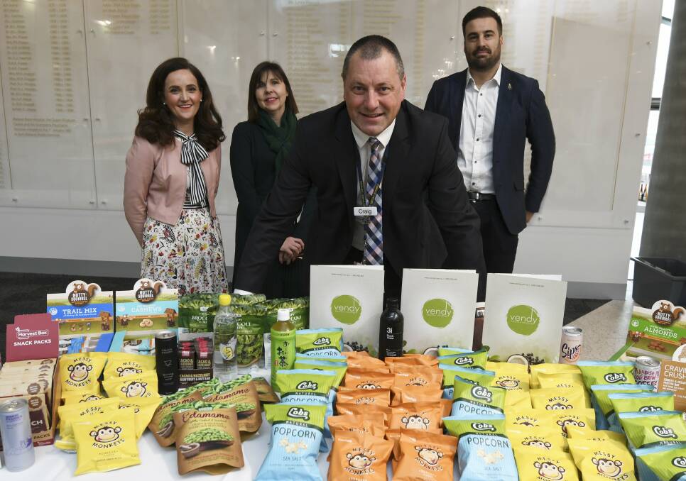 HEALTHY CHOICES: Ballarat Health Services dietitians Kate Falconer, Rebecca Nines, BHS community care executive director Craig Wilding and Vendy's Simon Collins offer a tasting for the hospital's new vending machine options. Picture: Lachlan Bence