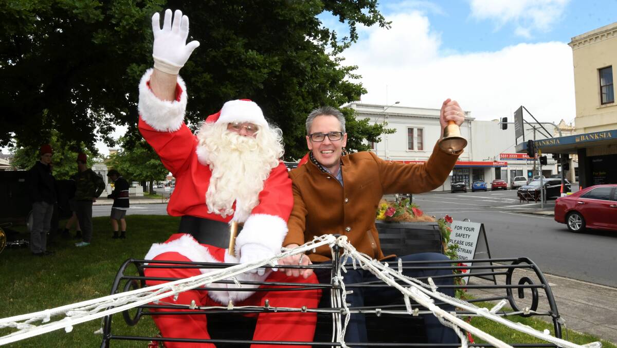 TAKE OFF: Santa and City of Ballarat mayor launch Christmas in Ballarat from the Sturt Street sleigh. Picture: Lachlan Bence