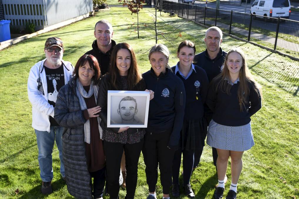 LEGACY: James Petrie's family including mum Anne Petrie, Emma Grills and his partner Jane Douglass join with Walking Off the War Within's John Shanahan and Josh Martin, Ballarat High year 12 Charli Jones and Riva Springbett and teacher Mark Verbene raising support for Walking Off the War Within. Picture: Lachlan Bence.