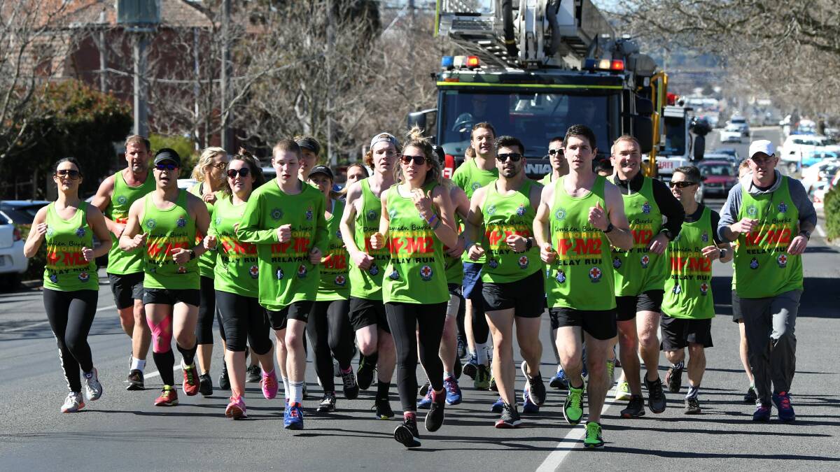 Emergency services workers make their way up Mair Street in the Damien Burke Memorial Relay Run from Mildura to Melbourne. Picture: Lachlan Bence