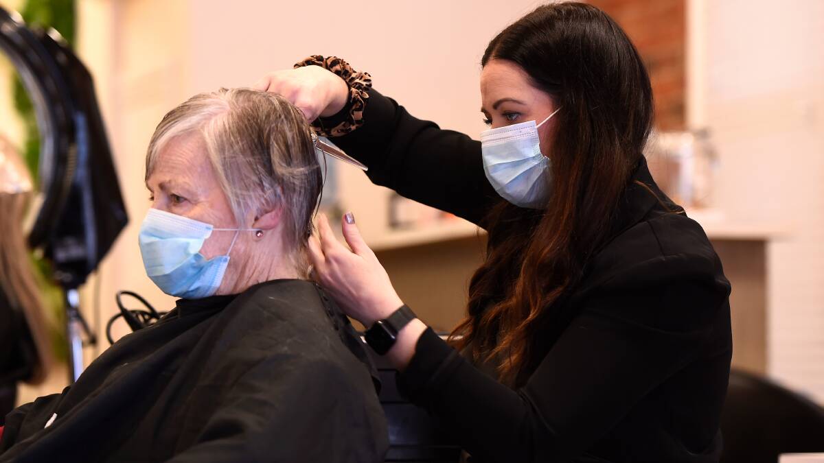 Hairdressers cut above regional rules, styling masks for safety
