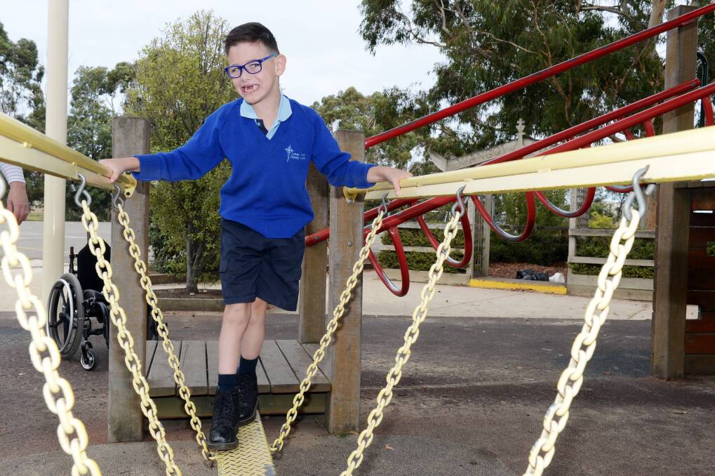 SMILES: Active youngster Bohdi Pilat loves testing the play equipment at his school. The seven-year-old is a regular visitor at the Royal Children's Hospital and knows all too well how special the hospital is for families. Picture: Kate Healy 