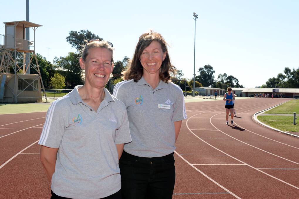 HONOURS: Ballarat athletics official and mentor Sarah Davis, pictured with fellow official Christine Christie, says the past two years have been tough on volunteers but they have worked hard to support each other on the sidelines.