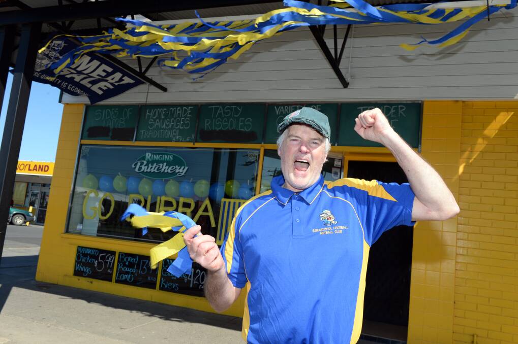 COOKING: Burras' supporter Barry Ringin's butchery shows its community and club pride in Albert Street.