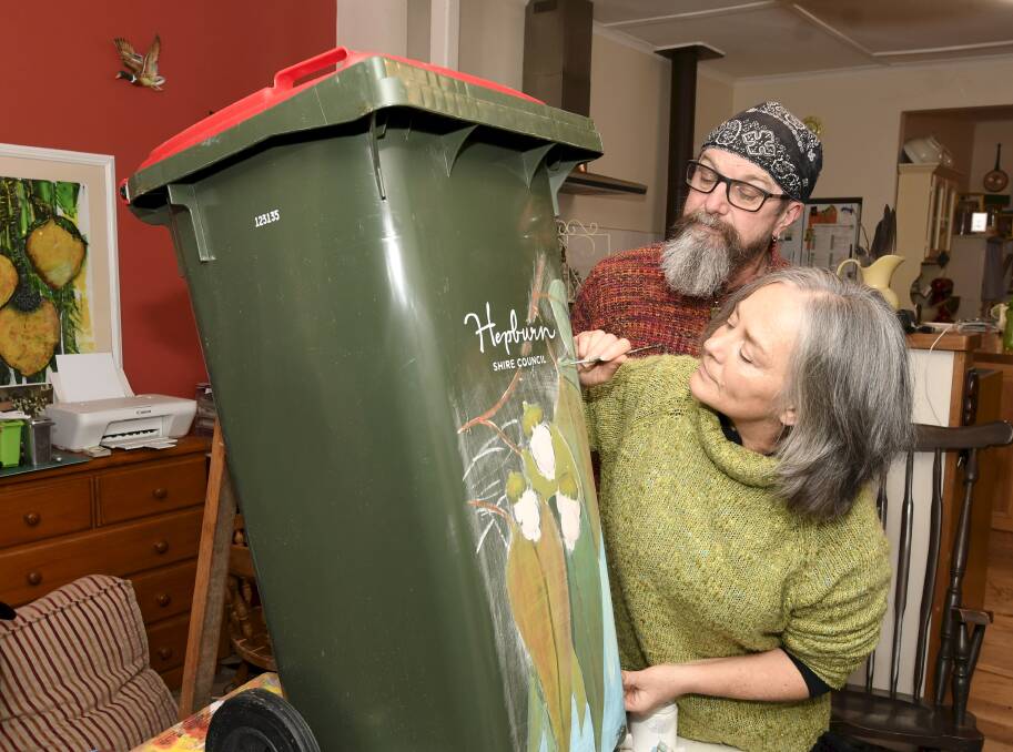 BRUSHING UP BINS: Ross Jones and Lisa Timson started a community project painting bins in Creswick. Picture: Lachlan Bence