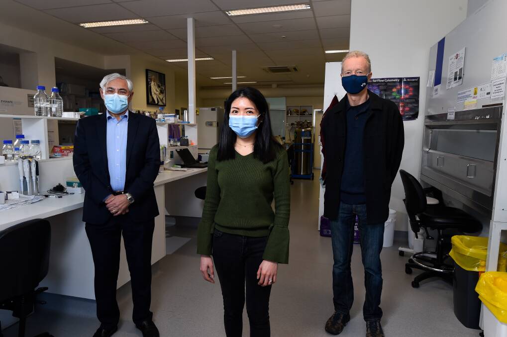 CLOSE LOOK: FECRI director George Kannourakis and researcher Dilys Leung with BJT Legal trustee Andrew Byrne prepare to step up work on proteins on chronic lymphocytic leukaemia cells. Picture: Adam Trafford