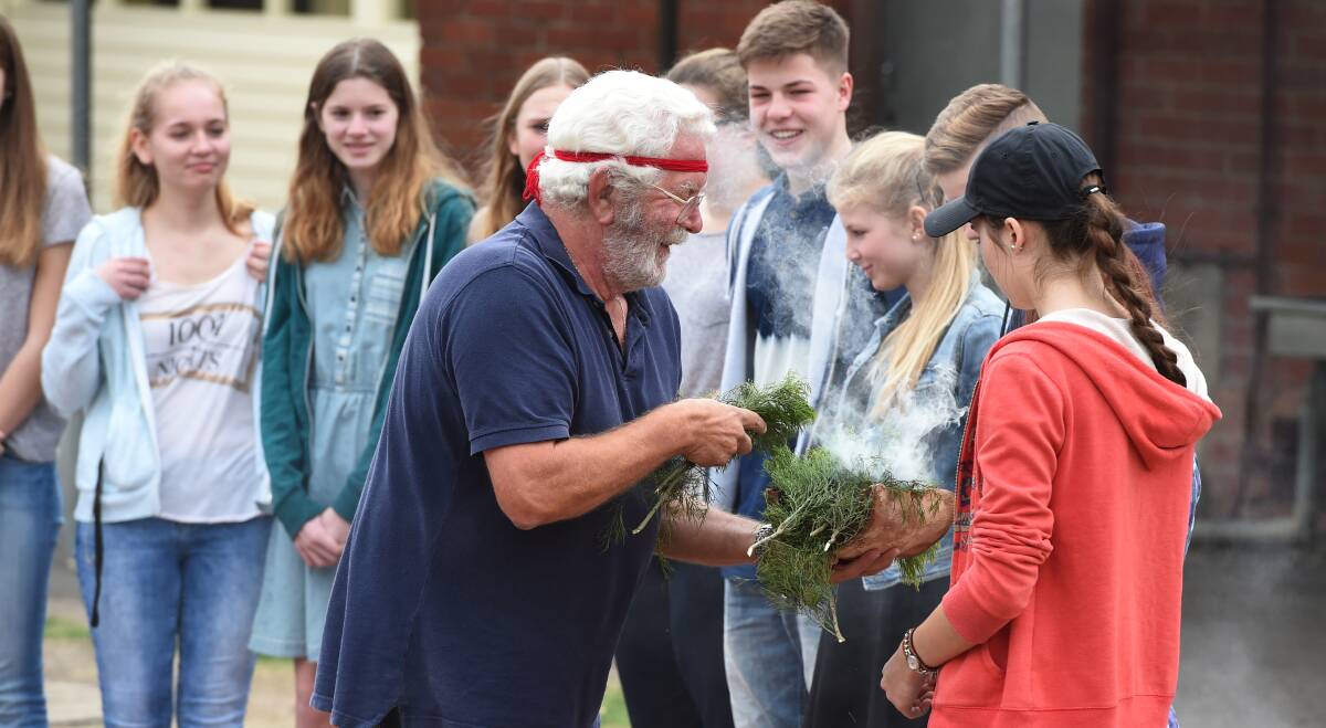 WELCOME: Wadawurrung elder Uncle Bryon Powell welcomes German exchange students in a traditional smoking ceremony. Picture: Kate Healy 