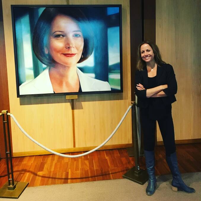 LEGACY: Clare Wright visits the new portrait of Prime Minister Julia Gillard in Parliament House on Friday, almost 120 years since Australian women won the right to vote and stand for federal parliament.