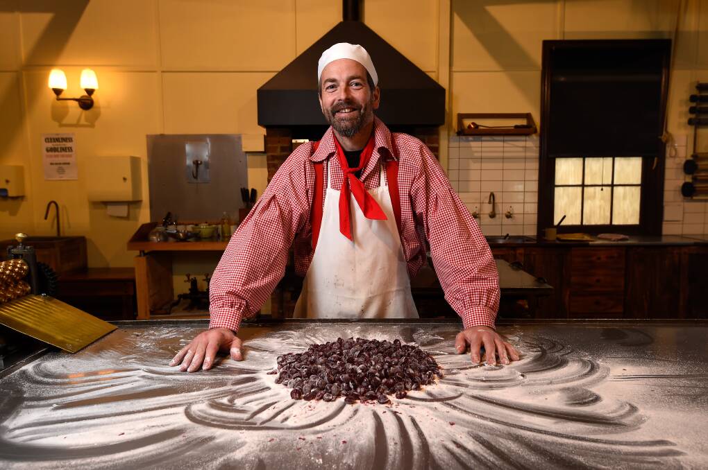 PREPARATION: Sovereign Hill confectioner Ben Bignell has batches of raspberry drops at the ready from his first day back in Brown's Confectionery shop. Picture: Adam Trafford