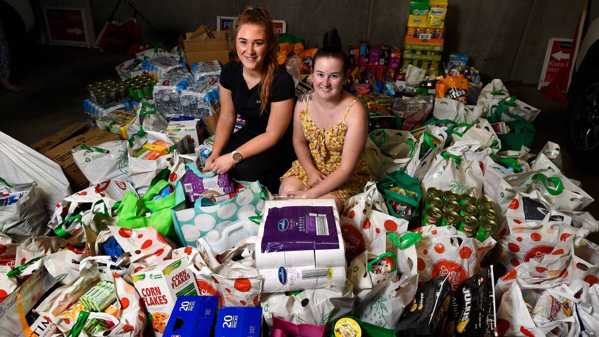 GIVING COMMUNITY: PRDnationwide Ballarat sales consultant Kiara Porra and donor Tegan Stevenson are overwhelmed at the community's response to a call out for items for bushfire relief. Pictures: Adam Trafford