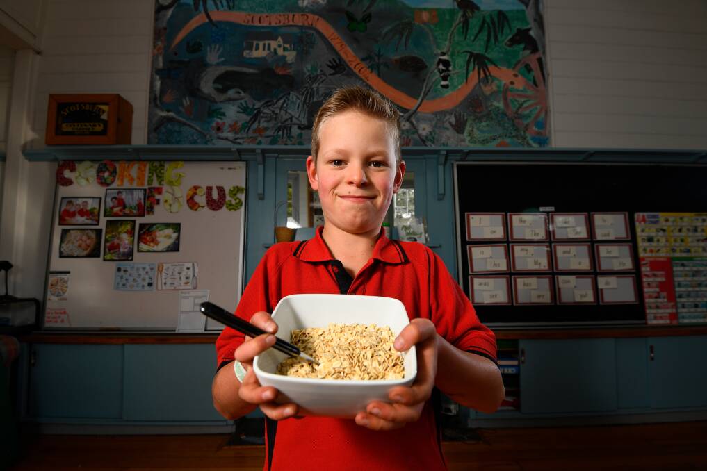 RESPONSE: Jack Conroy sells porridge to classmates to feed nursery school children in Malawi. Picture: Adam Trafford
