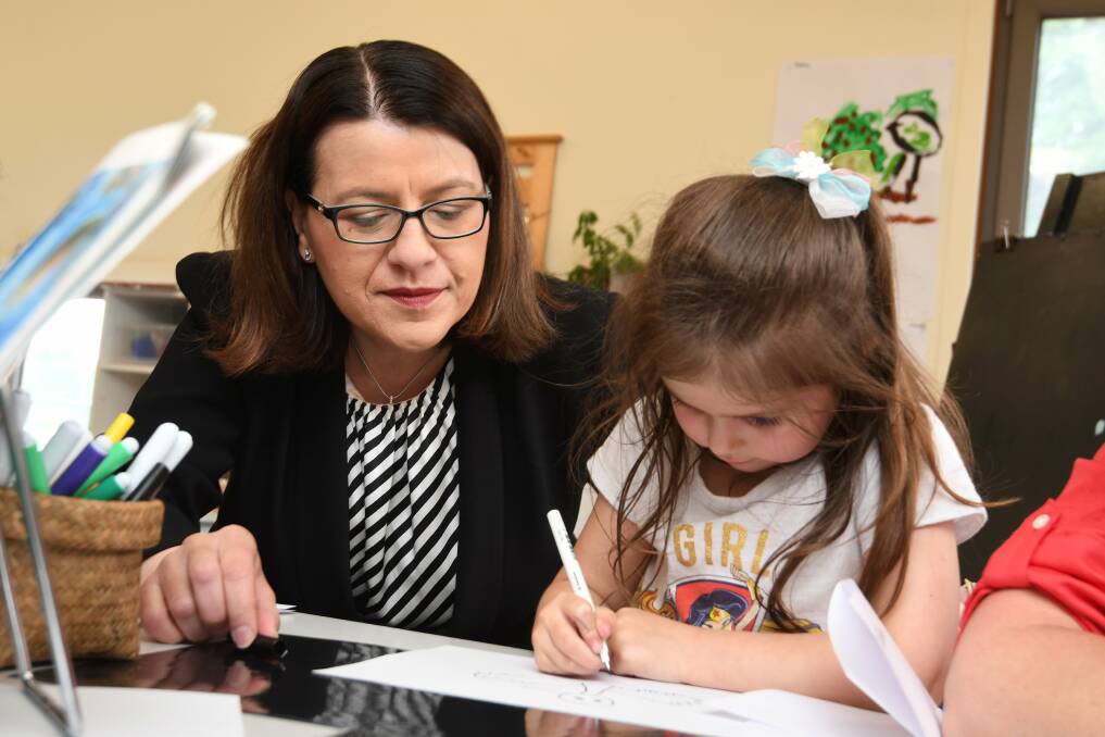 LEARNING: Early Childhood Minister Jenny Mikakos works on a drawing with five-year-old Marley at Midlands Kindergarten on Wednesday afternoon. Picture: Lachlan Bence