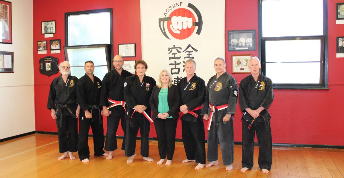 PREPARED: Wendouree MP Sharon Knight meets Ballarat Karate Club's seniors group at their dojo to deliver funding for a new defibrilator. 