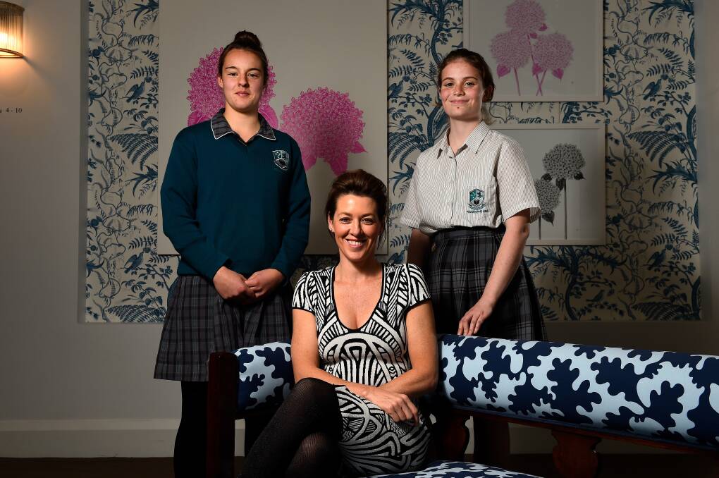 GUIDING: Television presenter Gorgi Coghlan with Woodman's Hill students Emma Van Egmond and Veronica McCarthy amid a special luncheon at Lola. Picture: Adam Trafford